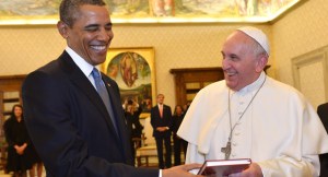 Pope Francis and President Barack Obama smile as they exchange gifts, at the Vatican Thursday, March 27, 2014. President Barack Obama called himself a "great admirer" of Pope Francis as he sat down at the Vatican Thursday with the pontiff he considers a kindred spirit on issues of economic inequality. Their historic first meeting comes as Obama's administration and the church remain deeply split on issues of abortion and contraception. (AP Photo/Gabriel Bouys, Pool)